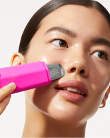 DERMAPORE+ SONIC SKINCARE SET - Pop | model using DERMAPORE+ from the DERMAPORE+ Sonic Skincare Set in Pop Pink