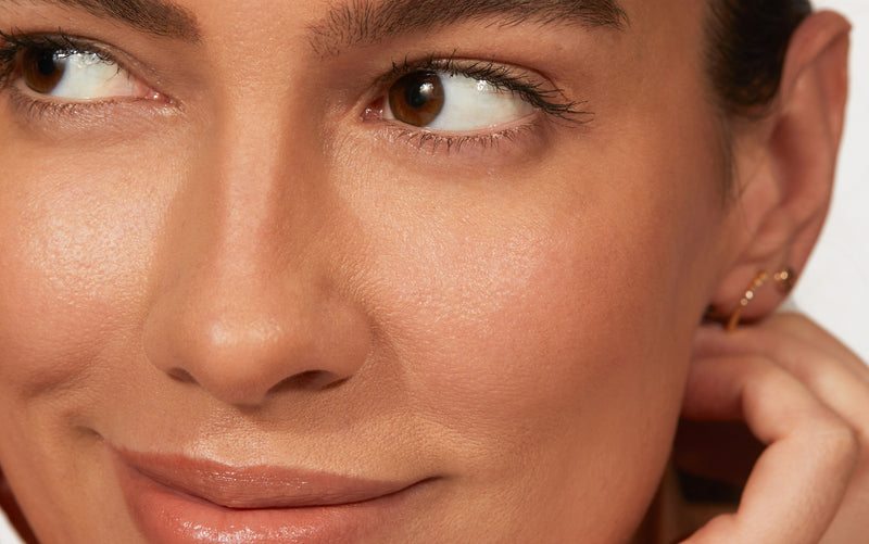 Image of model smirking and looking to the side