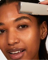 ULTIMATE SONIC SKINCARE SET - Stone | model using LUXE+ from the ULTIMATE SONIC SKINCARE SET in Stone