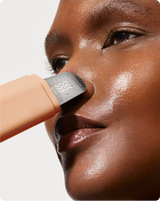 DERMAPORE+ - Peach Fuzz | model using DERMAPORE+ pore extractor in Peach Fuzz on her face