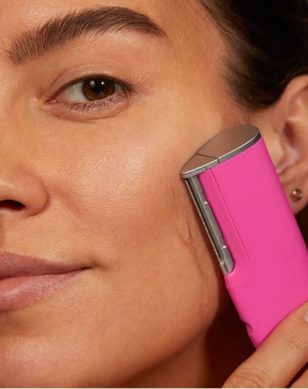 Pop Pink | model using LUXE+ from the LUXE+ Sonic Skincare Set in Pop Pink